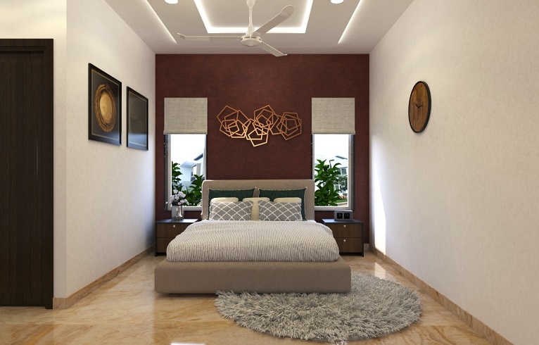 Master bedroom with maroon accent wall